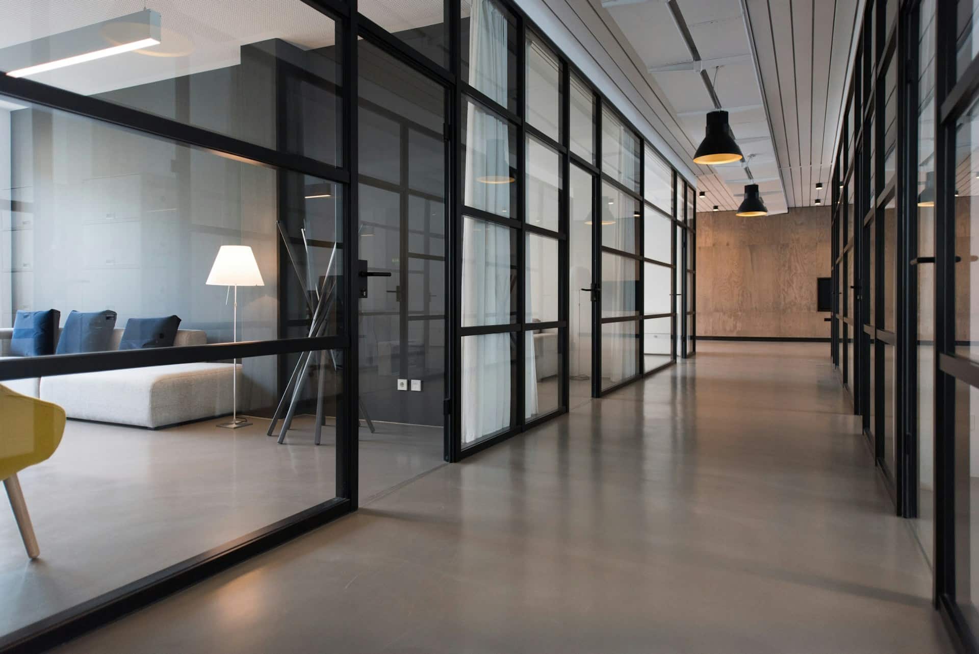 A contemporary office with glass-walled meeting rooms